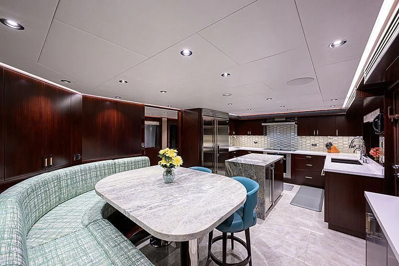 a room with a table and chairs aboard FLAMINGO DAZE Yacht for Sale