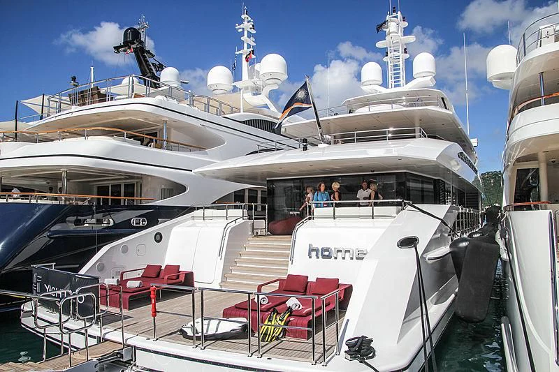 a large white boat with people on it aboard HOME Yacht for Charter