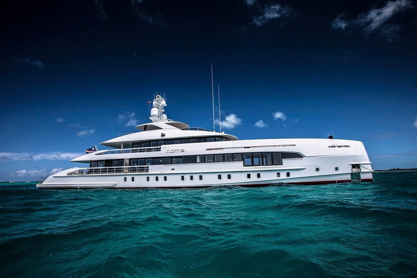 a white boat in the water aboard HOME Yacht for Charter