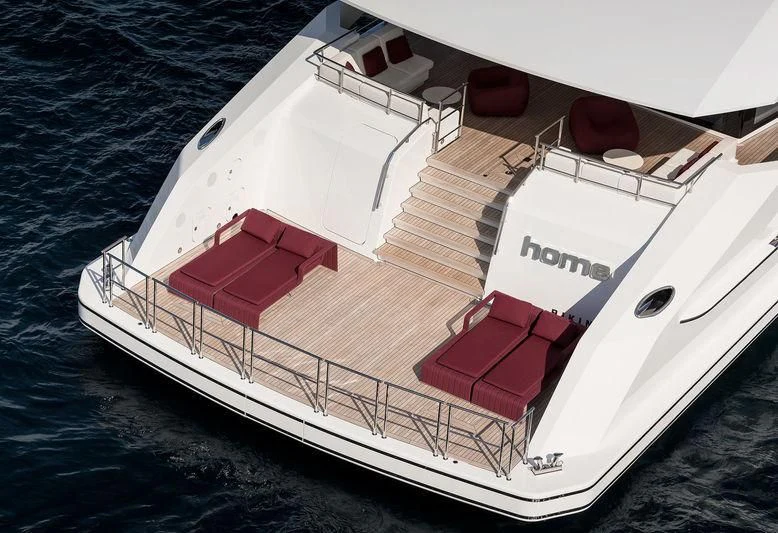 a white and red boat on the water aboard HOME Yacht for Charter