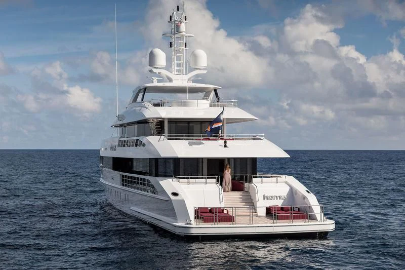 a white boat in the water aboard HOME Yacht for Charter