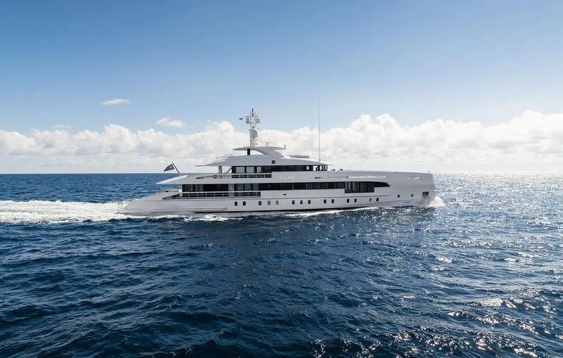 a large white boat in the water aboard HOME Yacht for Charter