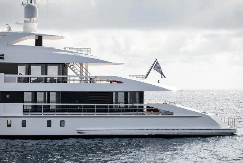 a large white boat on the water aboard HOME Yacht for Charter
