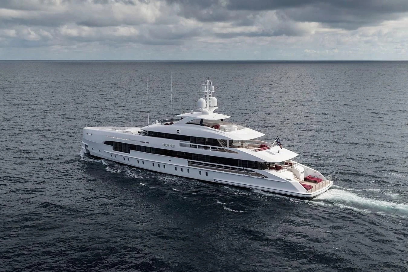 a white boat in the water aboard HOME Yacht for Charter