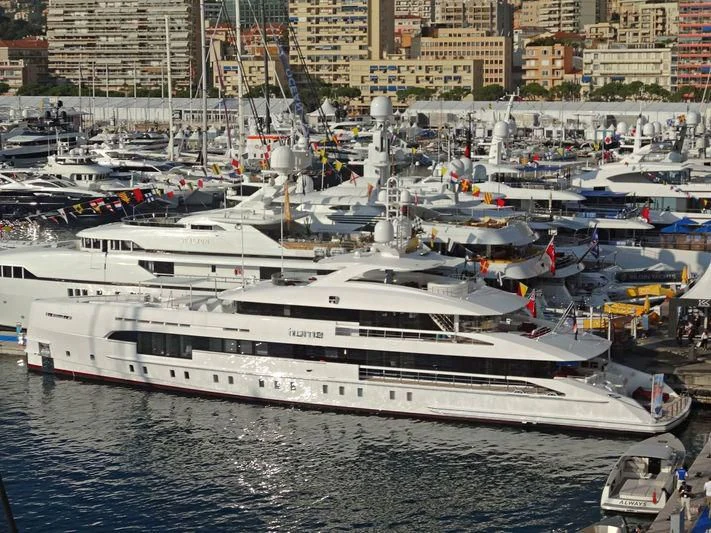 a large white boat is parked in the water aboard HOME Yacht for Charter