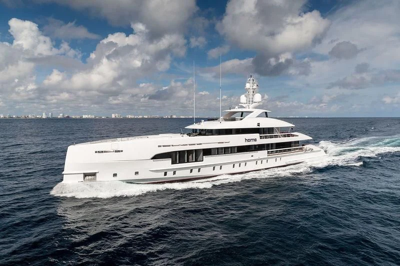 a white boat in the water aboard HOME Yacht for Charter