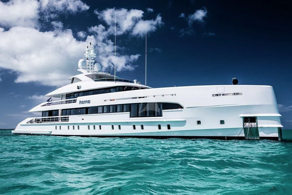 a white boat in the water aboard HOME Yacht for Charter