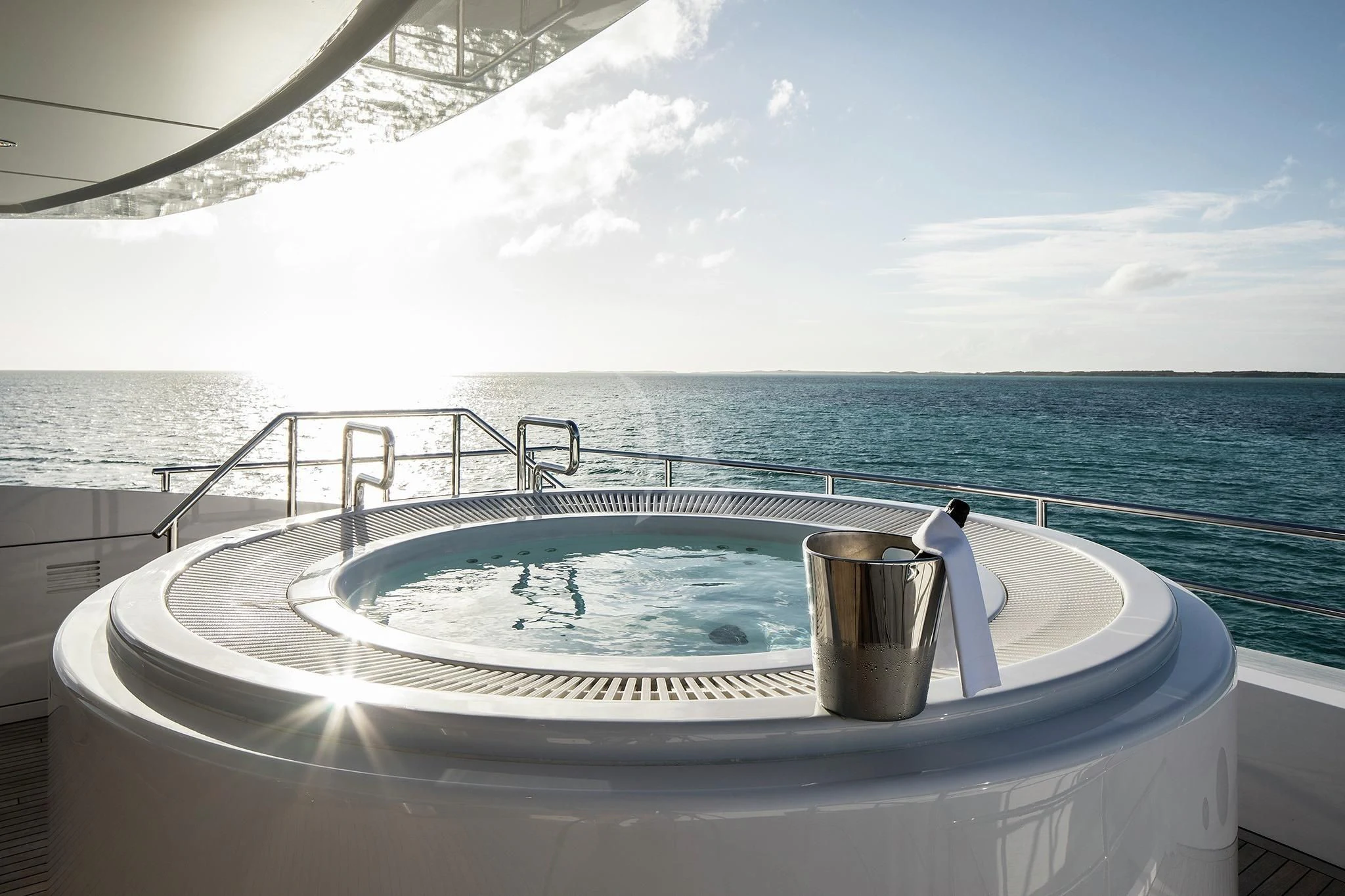 a tub with a sink and a cup on it aboard HOME Yacht for Charter