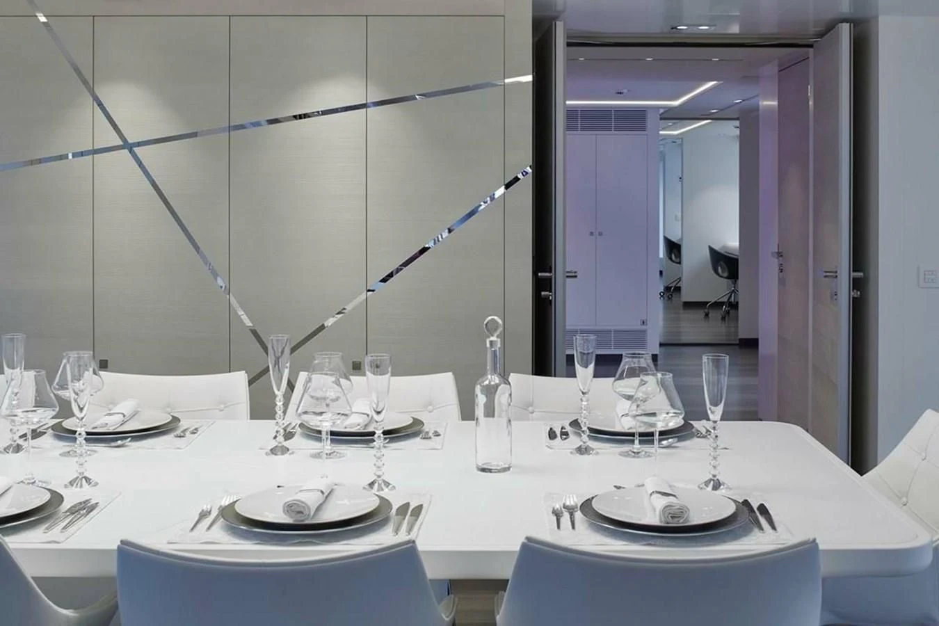 a table set for a dinner aboard HOME Yacht for Charter