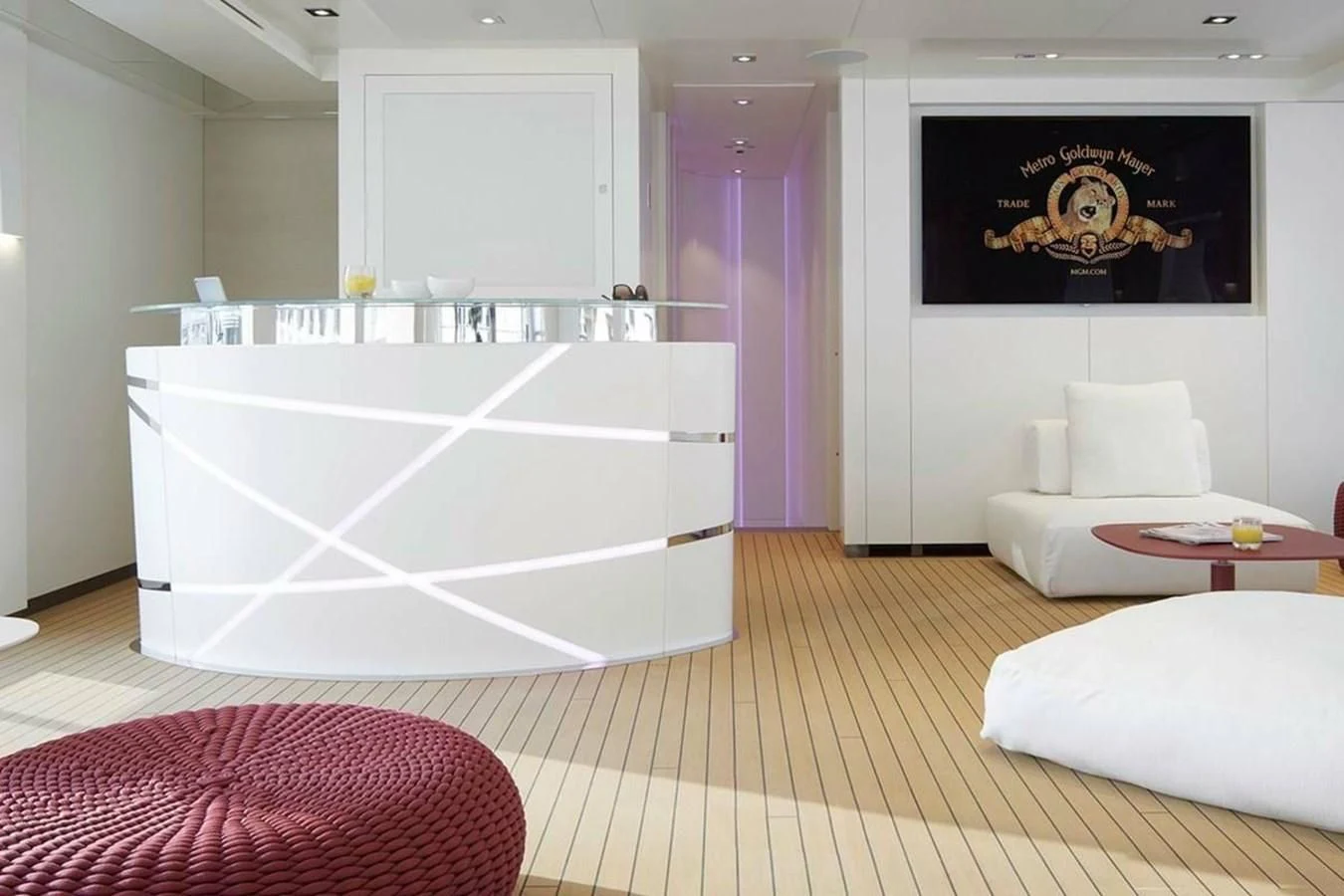 a large white bathtub in a room with a rug and a rug aboard HOME Yacht for Charter