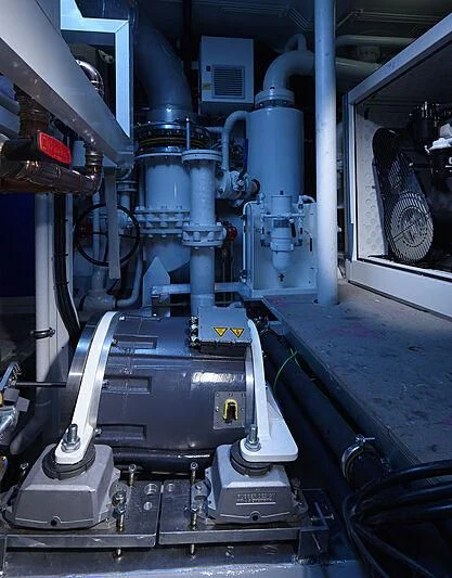 a machine with a large metal object aboard HOME Yacht for Charter