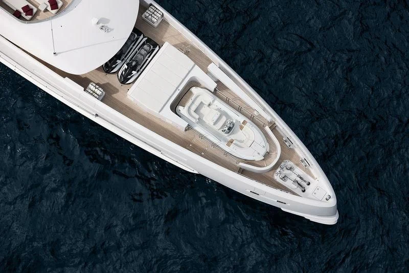 a white guitar on a black surface aboard HOME Yacht for Charter