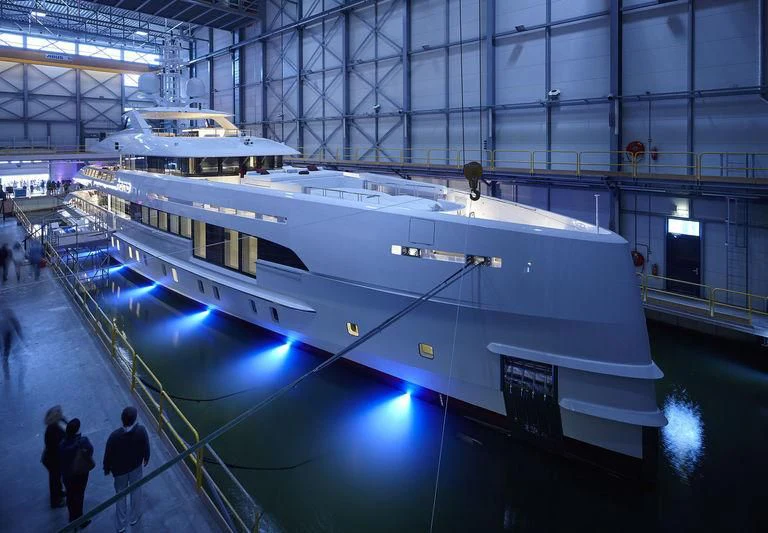 a large white boat in a building aboard HOME Yacht for Charter