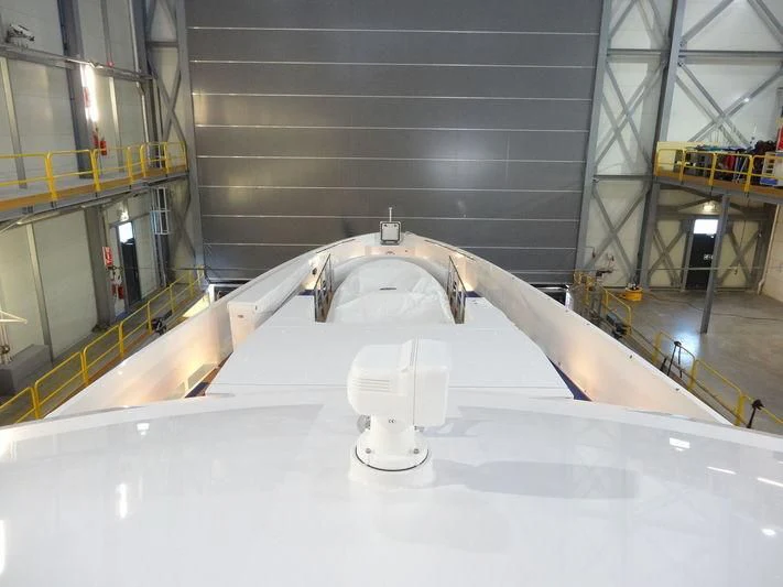 a large white room with a large white object on the floor aboard HOME Yacht for Charter