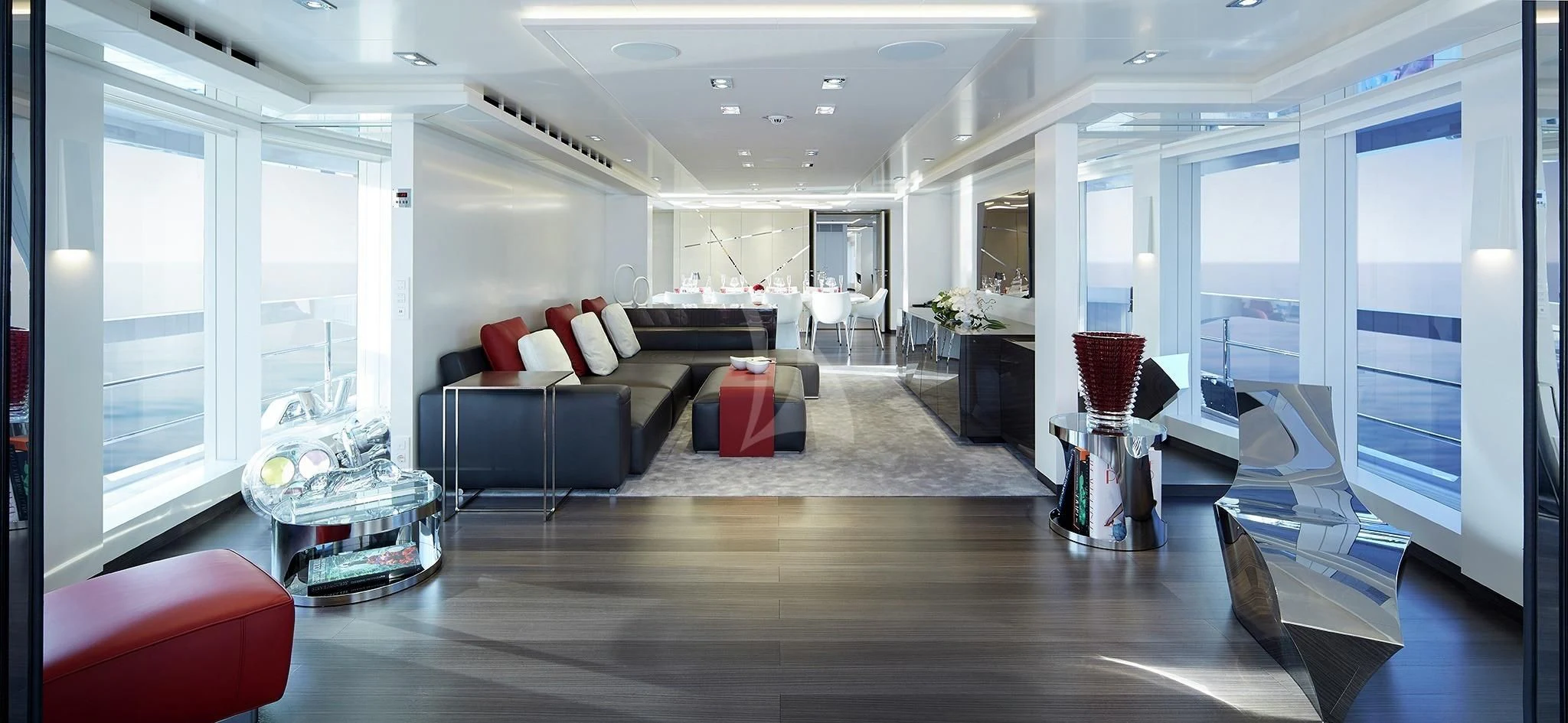 a living room with a large window aboard HOME Yacht for Charter