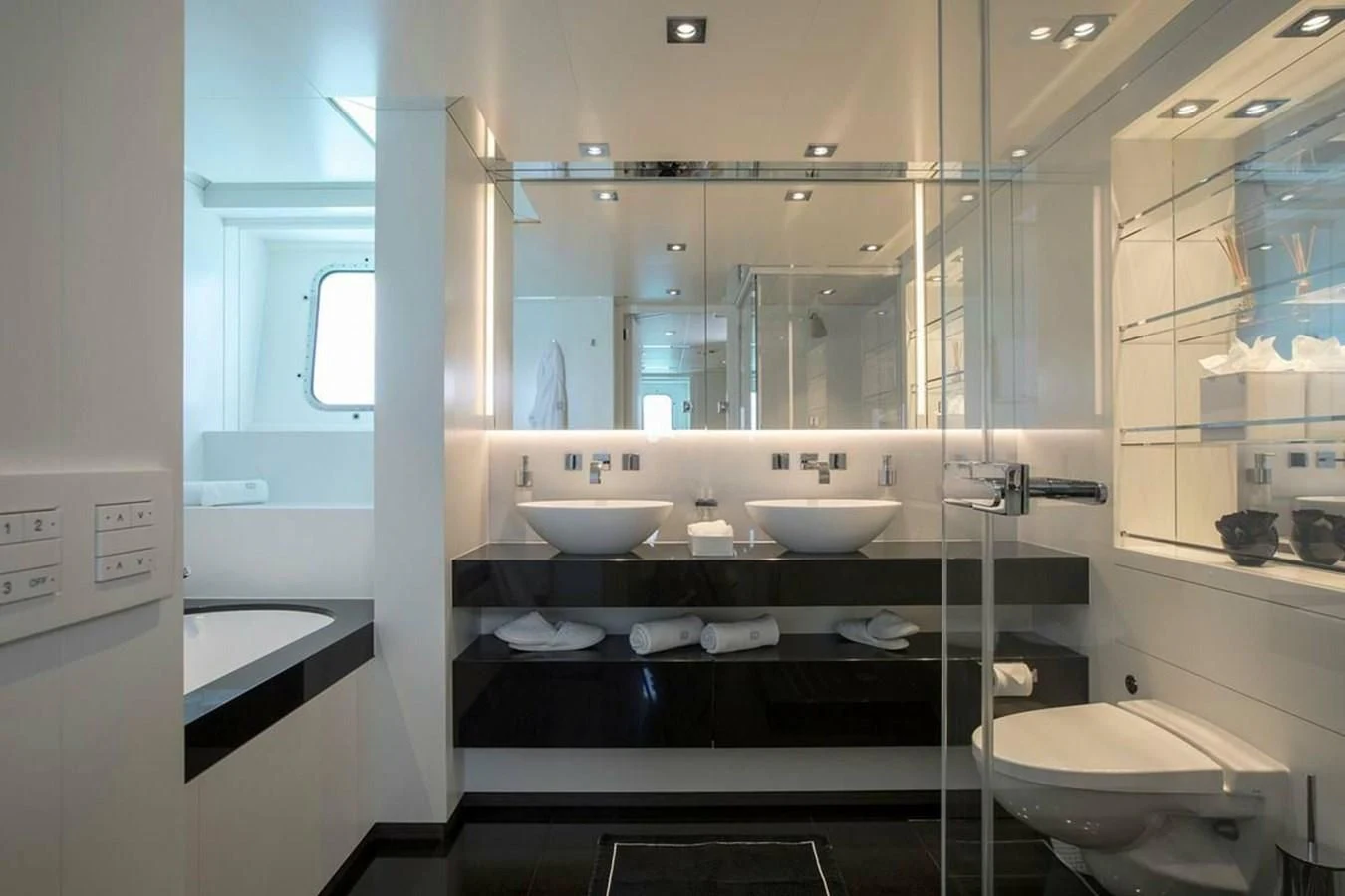 a bathroom with sinks and mirrors aboard HOME Yacht for Charter