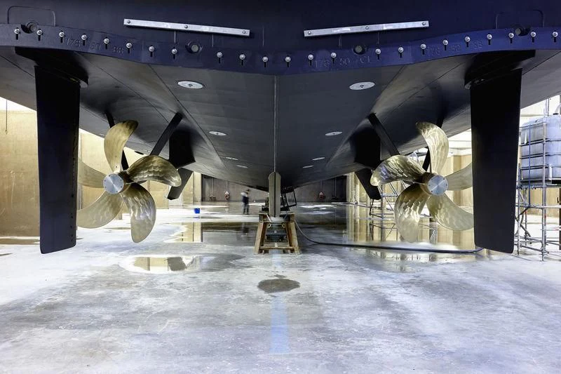 a large shark in a tank aboard HOME Yacht for Charter