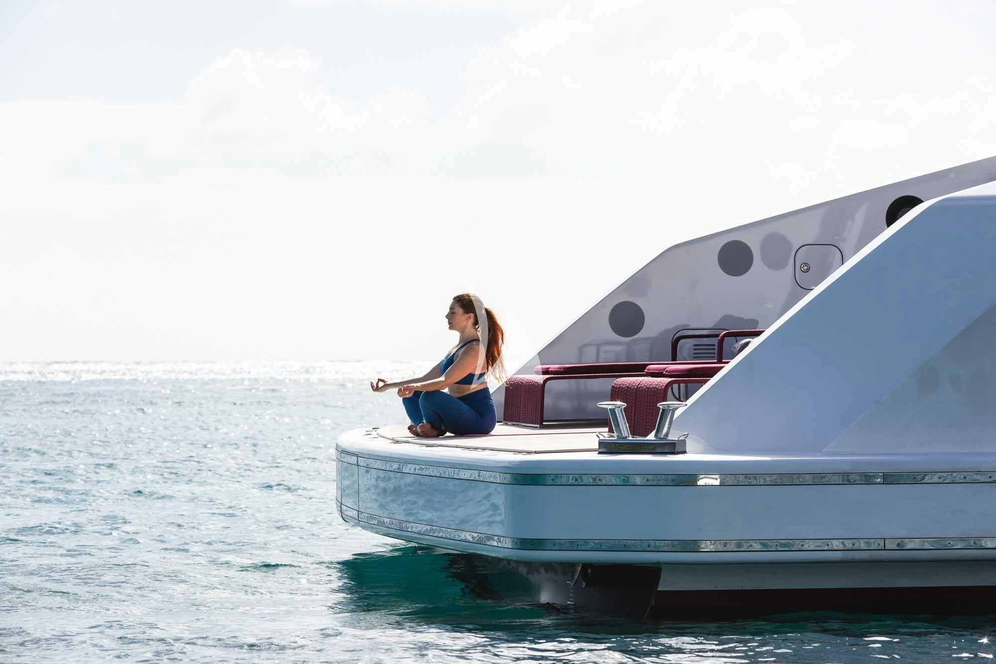a man sitting on a boat aboard HOME Yacht for Charter