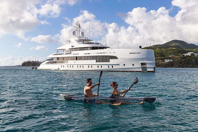 a couple of people in a boat in the water aboard HOME Yacht for Charter