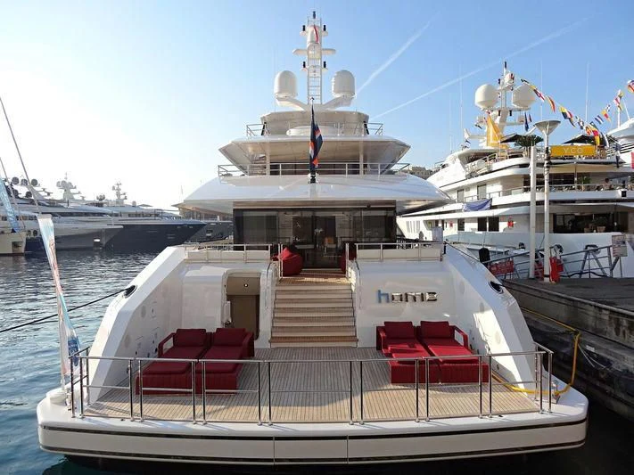 a boat docked at a pier aboard HOME Yacht for Charter