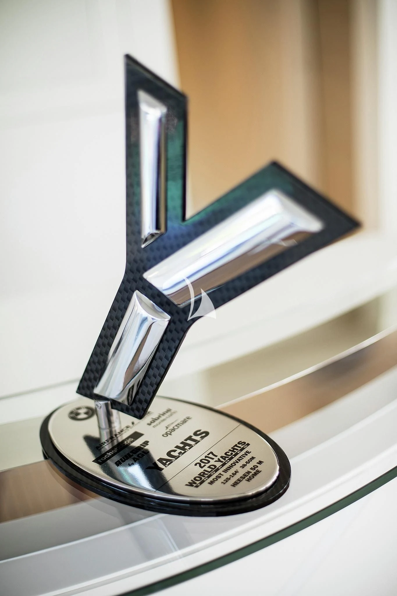 a watch on a table aboard HOME Yacht for Charter