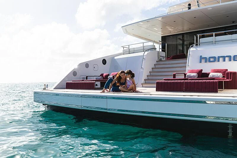a couple sitting on a boat aboard HOME Yacht for Charter