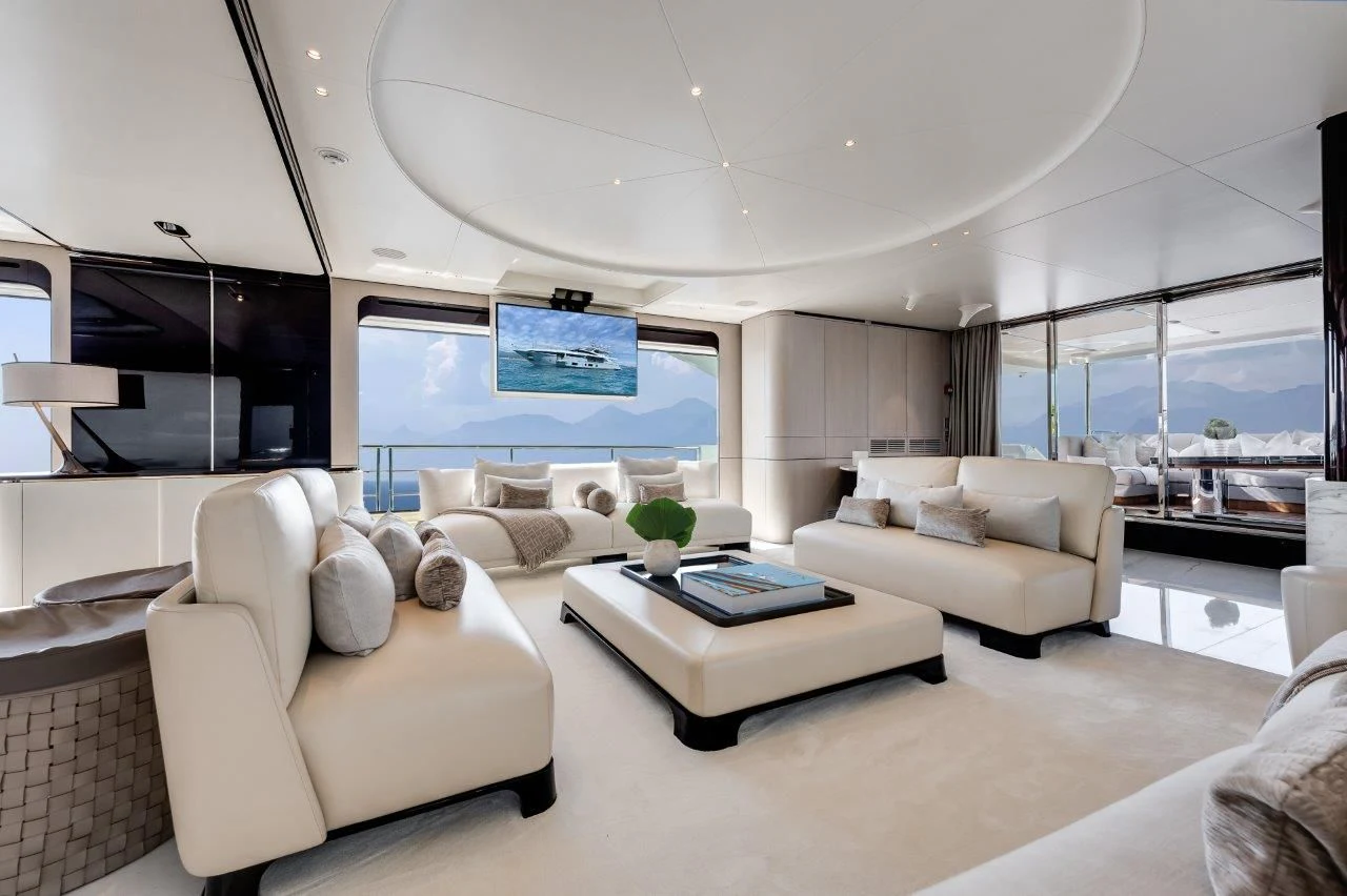 a living room with a large screen aboard ECLIPSE Yacht for Sale