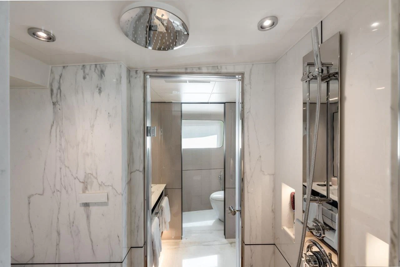 a bathroom with a shower and toilet aboard ECLIPSE Yacht for Sale