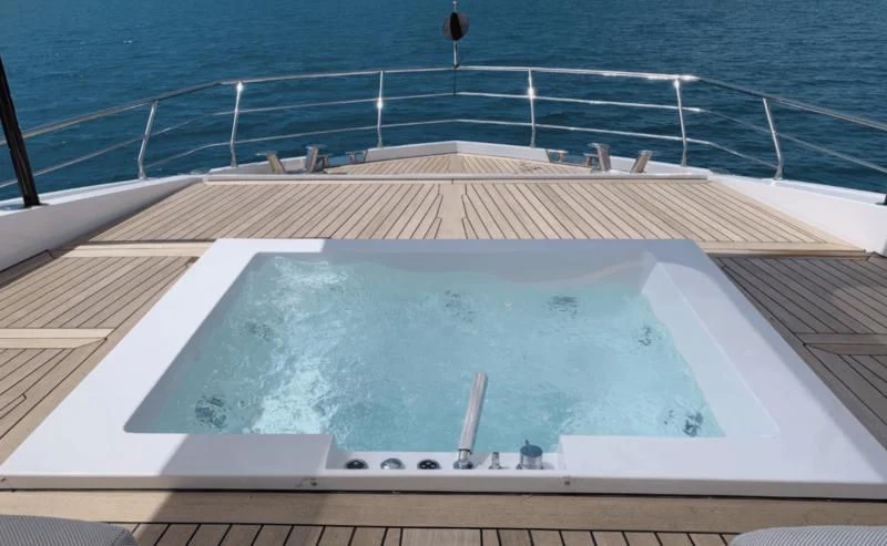 a large white boat on a body of water aboard ECLIPSE Yacht for Sale
