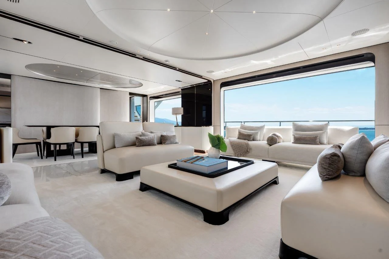 a living room with white furniture aboard ECLIPSE Yacht for Sale