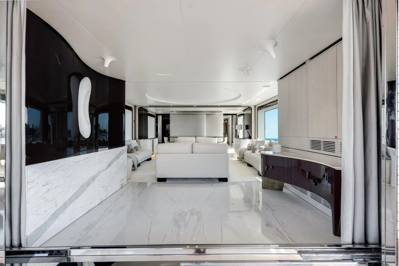 a large living room with white furniture aboard ECLIPSE Yacht for Sale