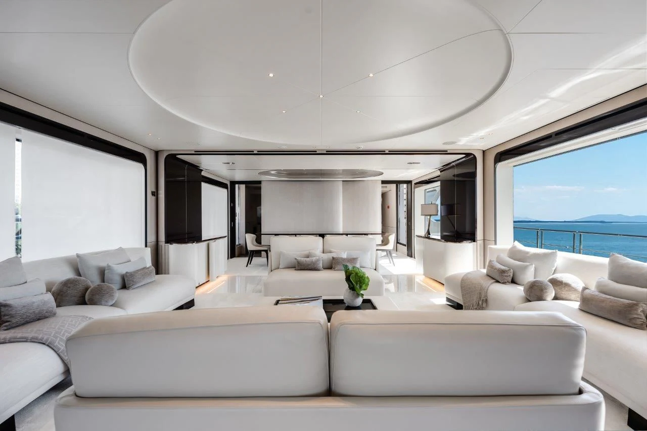 a living room with white furniture aboard ECLIPSE Yacht for Sale