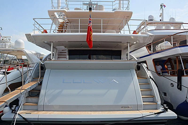 a boat with a flag on the front aboard ECLIPSE Yacht for Sale