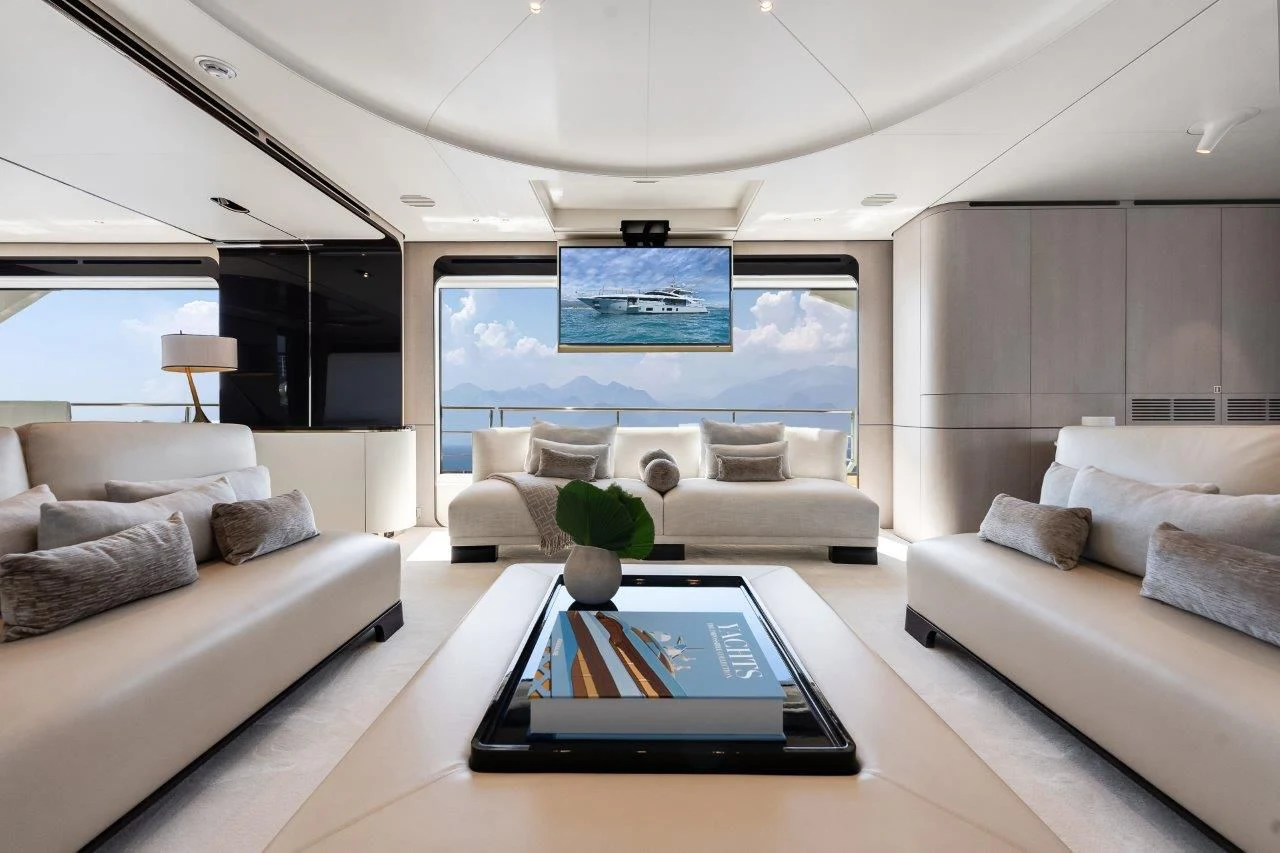 a living room with a large screen aboard ECLIPSE Yacht for Sale