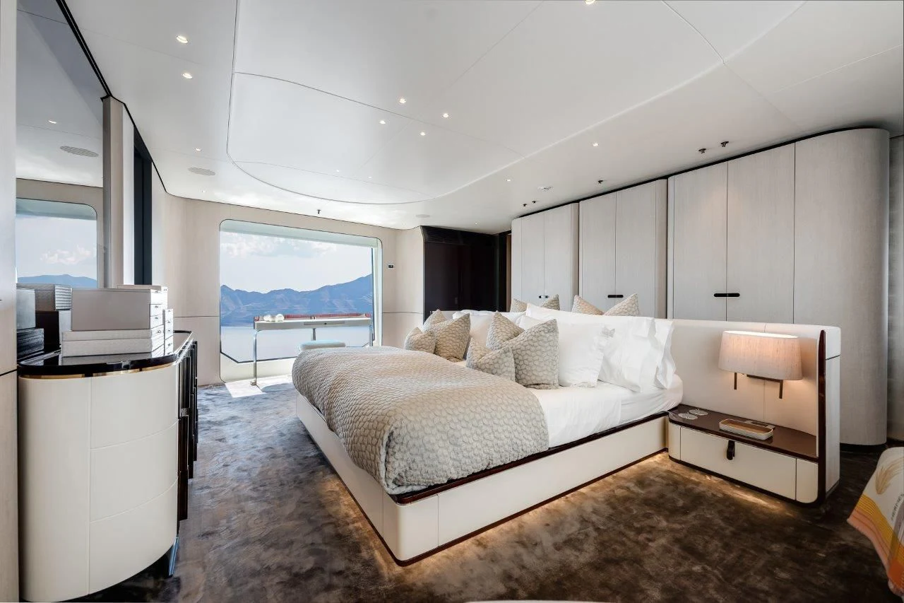 a bedroom with a large bed aboard ECLIPSE Yacht for Sale