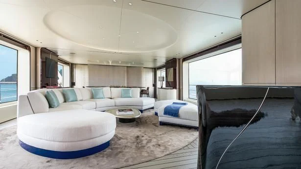 a living room with a couch and a rug aboard ECLIPSE Yacht for Sale