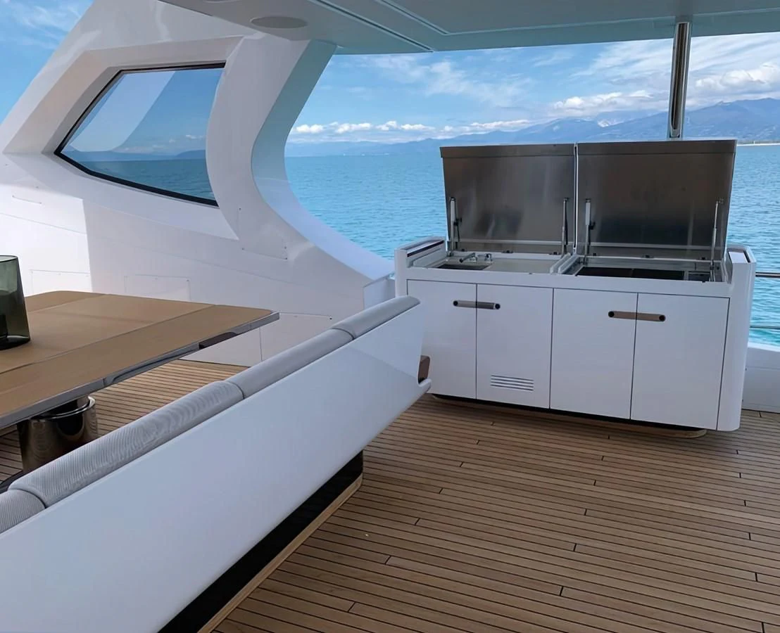 a room with a table and a tv on the wall aboard ECLIPSE Yacht for Sale