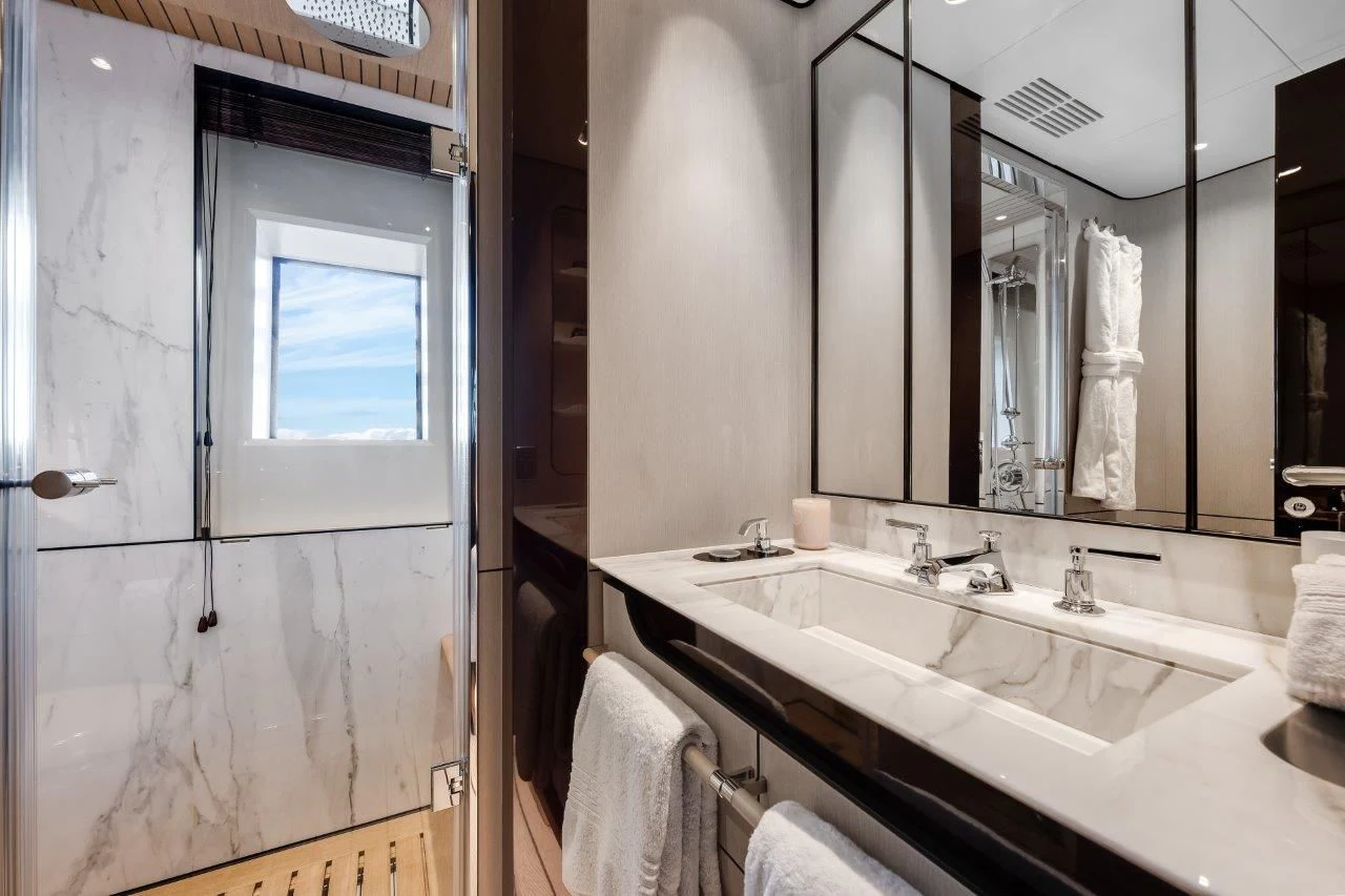 a bathroom with a large mirror aboard ECLIPSE Yacht for Sale