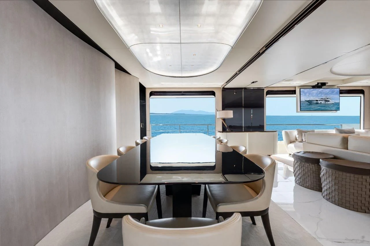 a room with a table and chairs aboard ECLIPSE Yacht for Sale