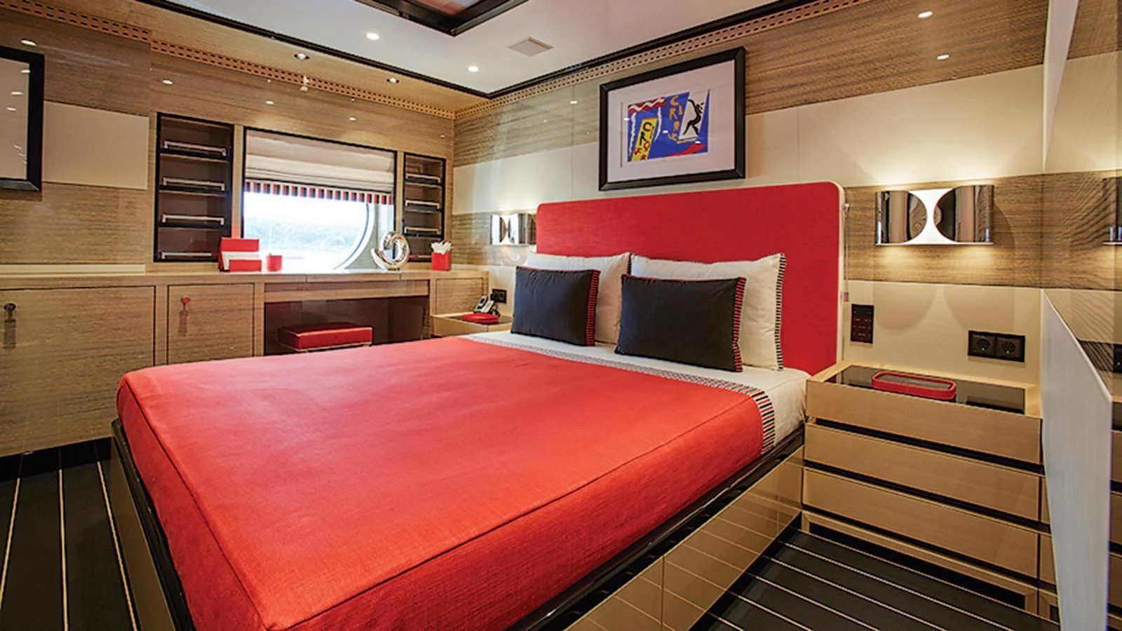 a room with a bed and a desk aboard MADAME KATE Yacht for Sale