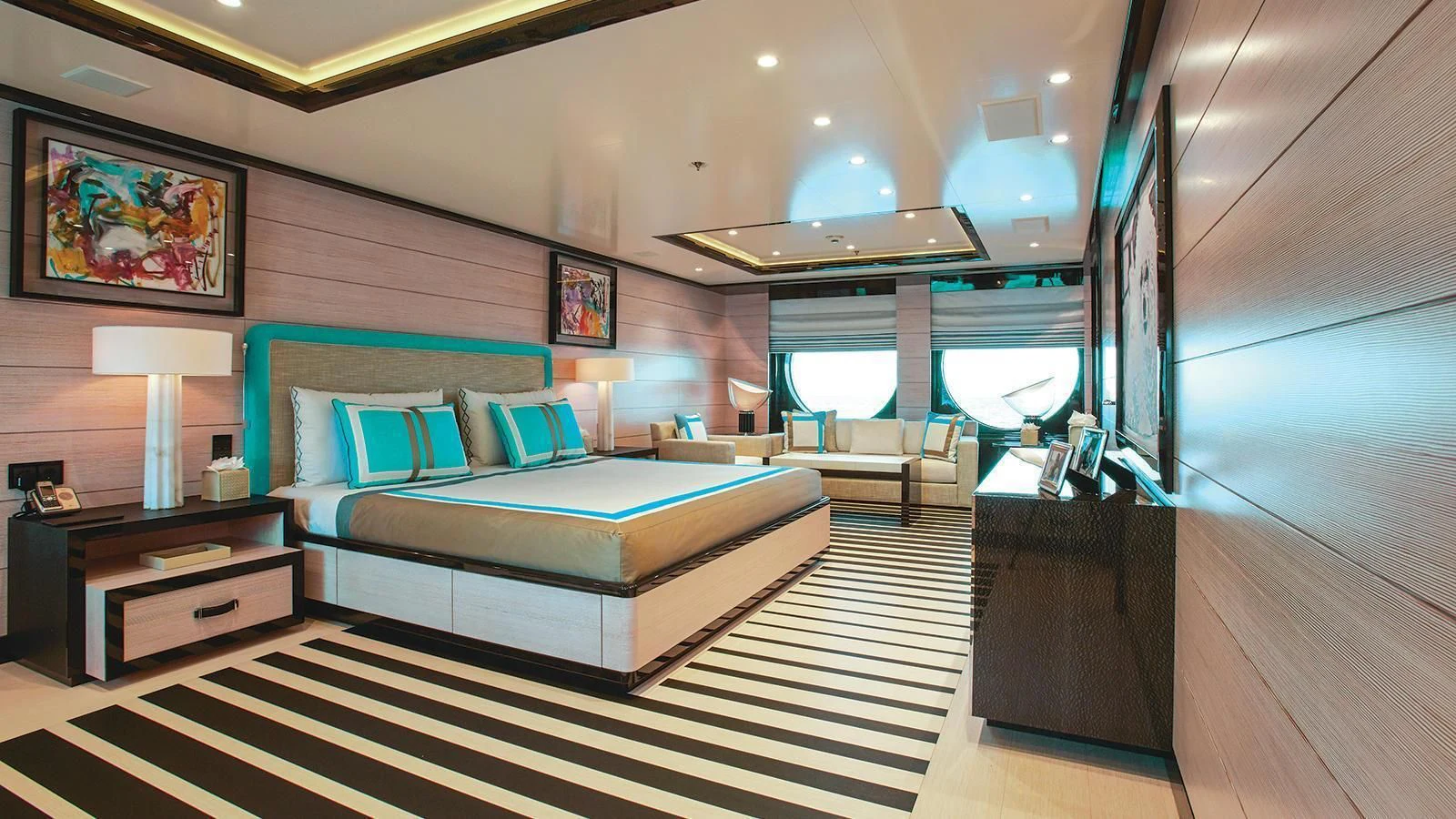 a room with a bed and a table aboard MADAME KATE Yacht for Sale