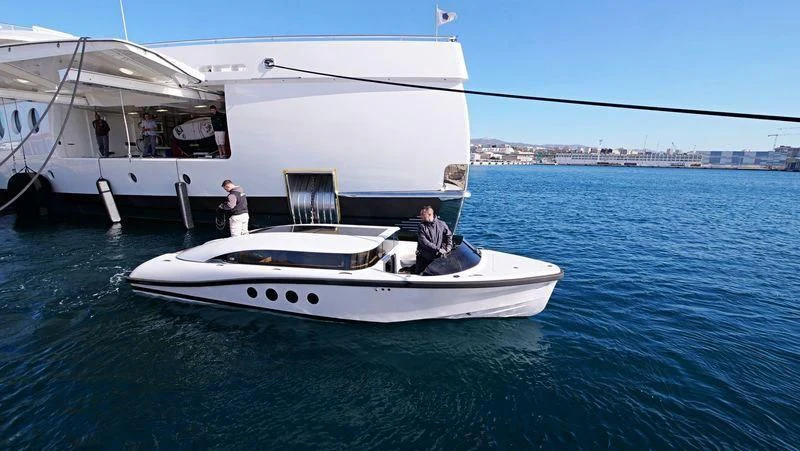 a man and a woman on a boat in the water aboard MADAME KATE Yacht for Sale