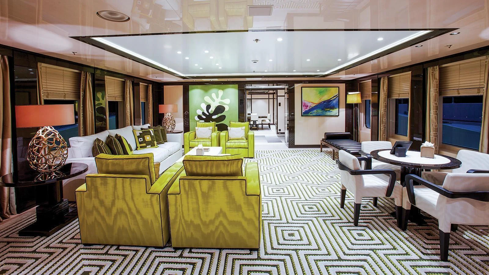 a room with tables and chairs aboard MADAME KATE Yacht for Sale