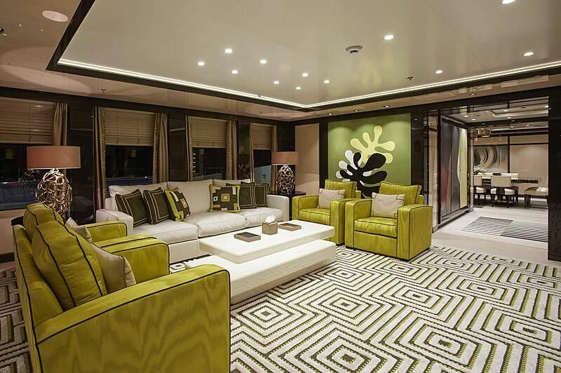 a large living room with a large glass wall aboard MADAME KATE Yacht for Sale