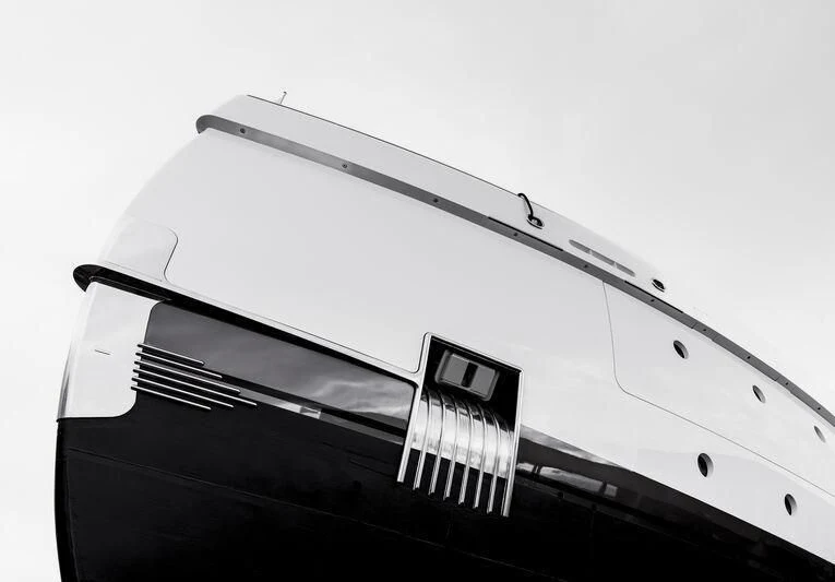 a black and white photo of a laptop aboard MADAME KATE Yacht for Sale