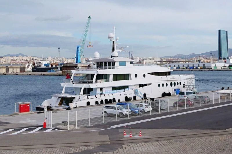 a large white boat on a dock aboard MADAME KATE Yacht for Sale