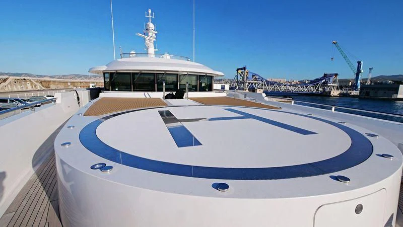 a large white boat on a dock aboard MADAME KATE Yacht for Sale