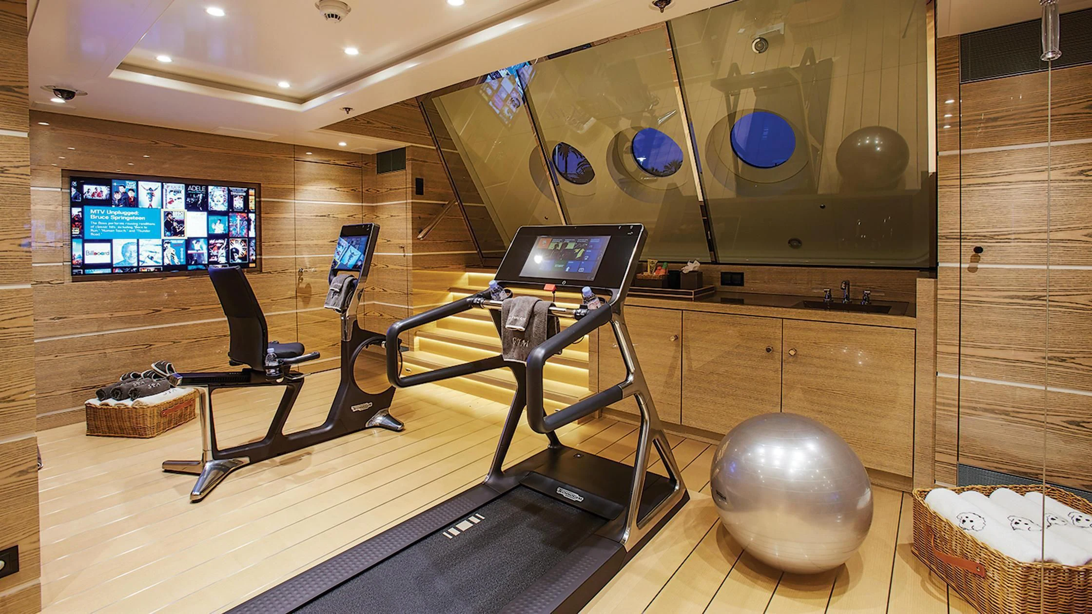 a room with a large ball and a large screen aboard MADAME KATE Yacht for Sale