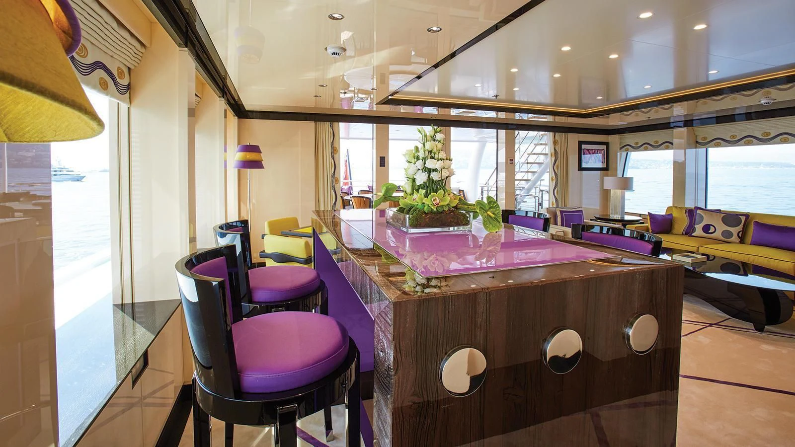 a room with a table and chairs aboard MADAME KATE Yacht for Sale