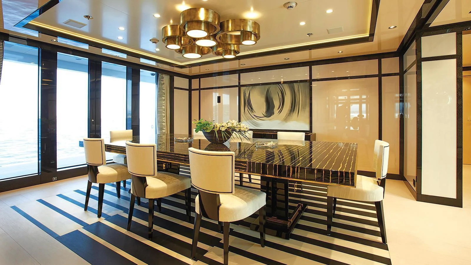 a room with chairs and a table aboard MADAME KATE Yacht for Sale